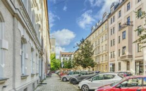 Old building street with parked cars at Orleansplatz in Munich