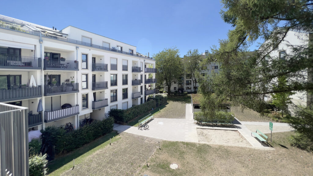 View of the balconies and the landscaped inner courtyard of a new residential building in Munich's Berg am Laim district