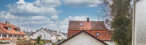 View over the rooftops of the neighboring houses from the apartment in Munich-Forstenried