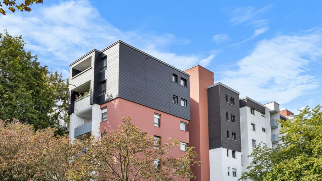 Facade of the multi-story residential building with balconies in Hadern