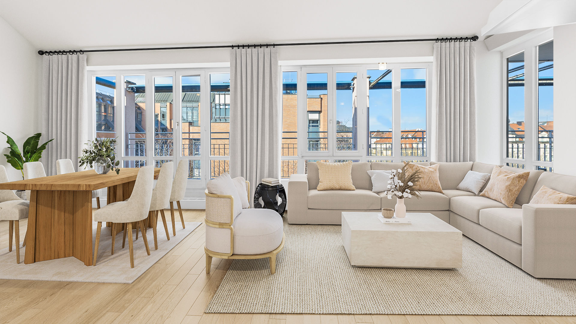 Modern bright living room with dining area, beige sofa, and floor-to-ceiling windows with city views in Haidhausen