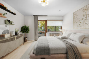 Virtual staging shows bedroom with double bed, wall shelf, and patio door in Munich-Lehel