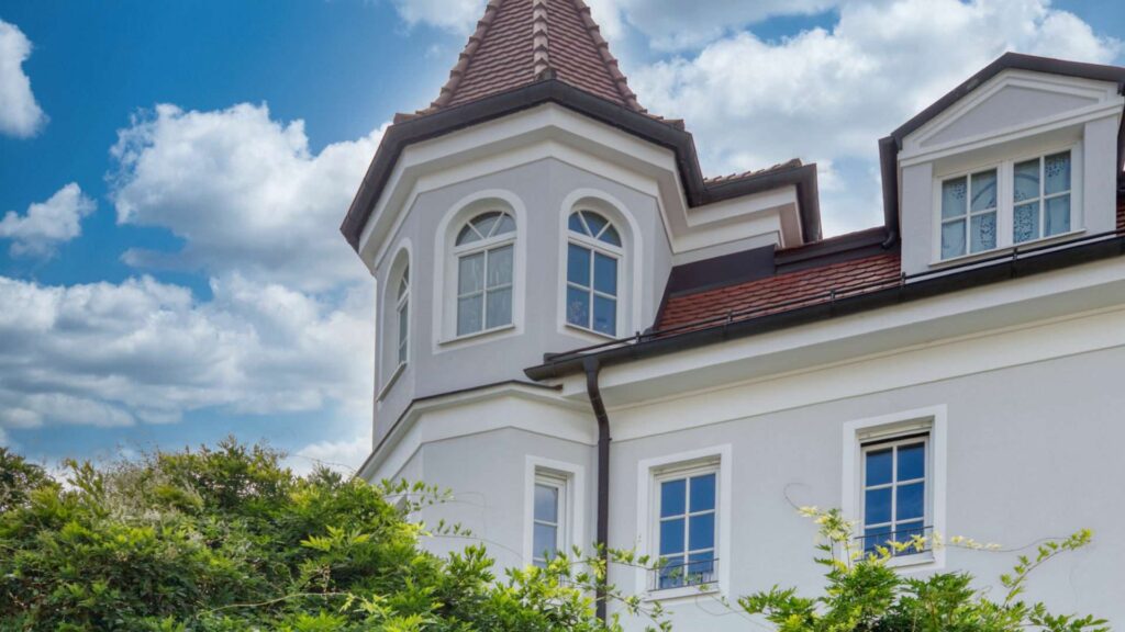 Facade of the historic villa with bay window and dormer gable in Nymphenburg