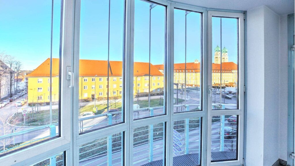 View through the window door of a historic building from the apartment in Munich-Sendling