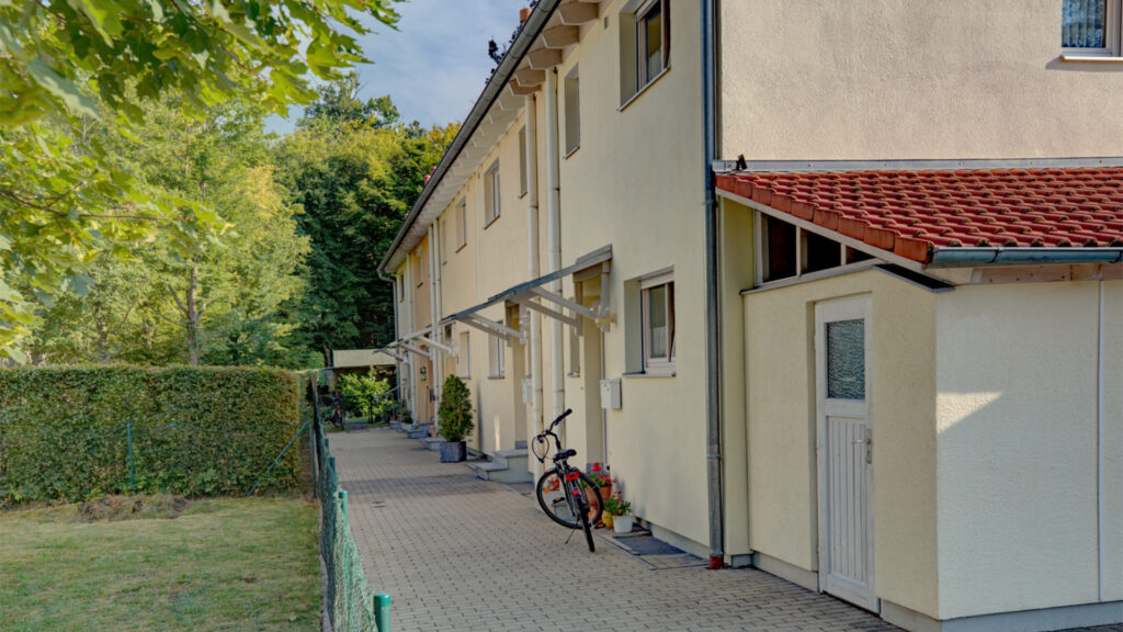 Paved access path to townhouses with a bicycle in Germering