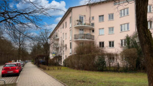 Multi-story residential building with a rounded balcony bay in the Untermenzing district of Munich