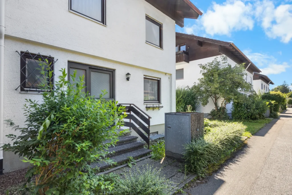 Front entrance with stairs, street view
